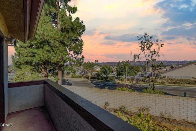 view of balcony at dusk