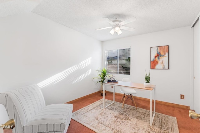 carpeted office space featuring lofted ceiling, ceiling fan, and a textured ceiling