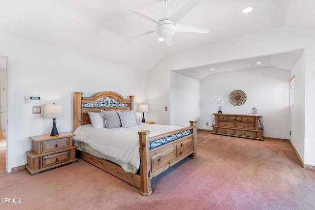 carpeted bedroom with ceiling fan and lofted ceiling