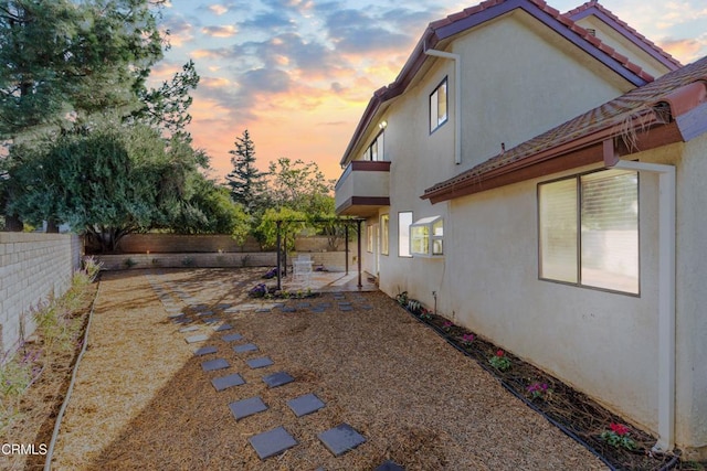 yard at dusk with a patio