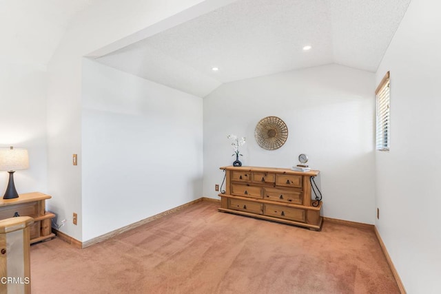 bedroom featuring carpet floors and vaulted ceiling