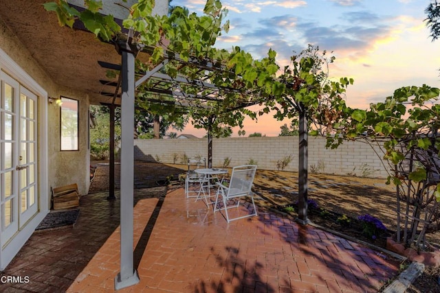 view of patio terrace at dusk