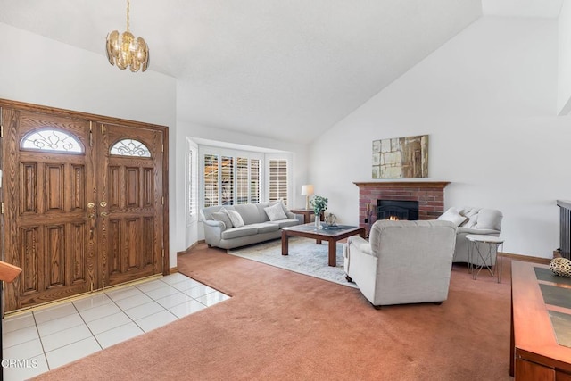 living room featuring an inviting chandelier, light colored carpet, high vaulted ceiling, and a brick fireplace