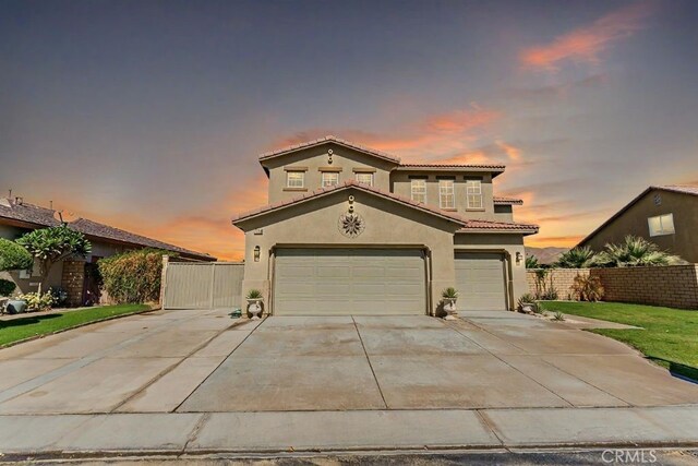 mediterranean / spanish-style house featuring a garage