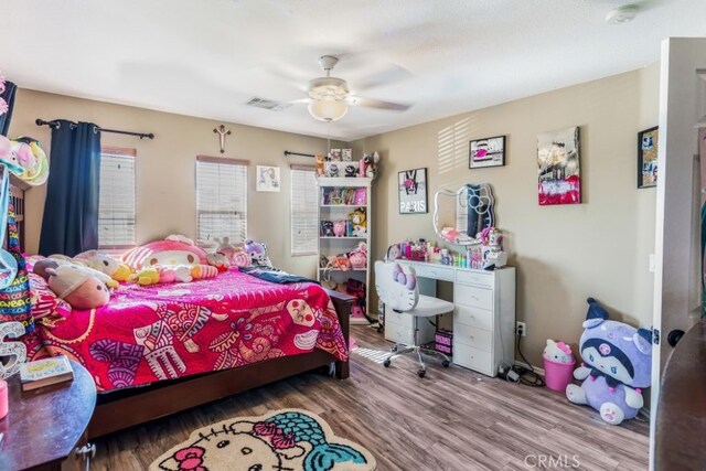 bedroom featuring hardwood / wood-style flooring and ceiling fan