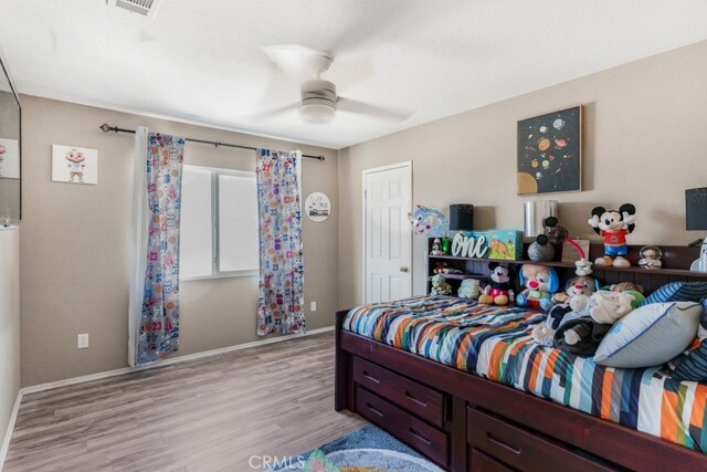 bedroom featuring light hardwood / wood-style flooring and ceiling fan