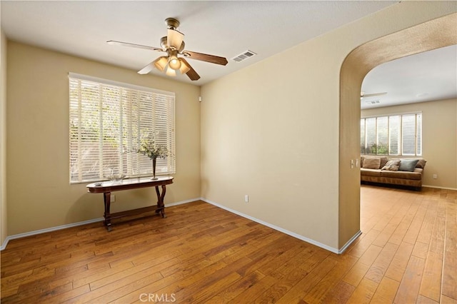 unfurnished room featuring ceiling fan and light hardwood / wood-style flooring