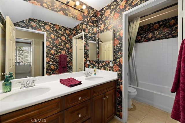 full bathroom featuring tile patterned flooring, vanity, toilet, and shower / bathtub combination with curtain