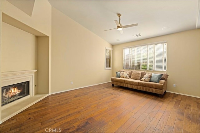 living room featuring ceiling fan and hardwood / wood-style floors