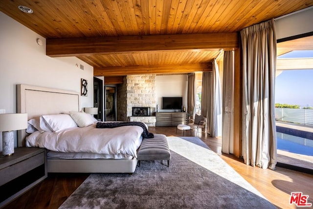 bedroom with multiple windows, dark wood-type flooring, wooden ceiling, and beamed ceiling