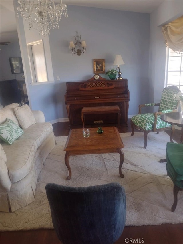 living room featuring hardwood / wood-style floors and a notable chandelier