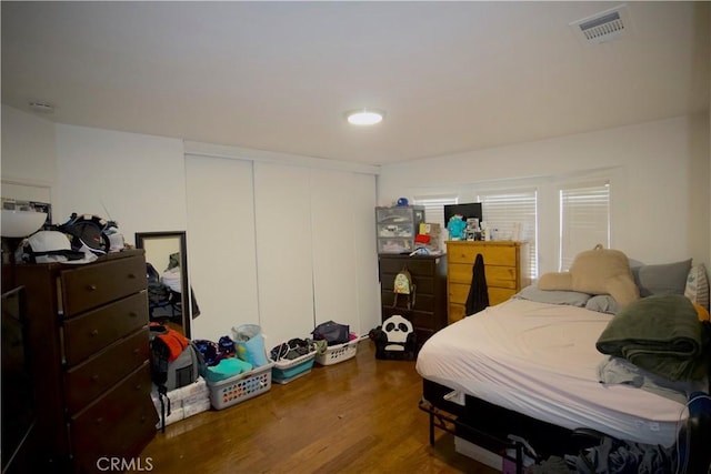 bedroom with wood-type flooring