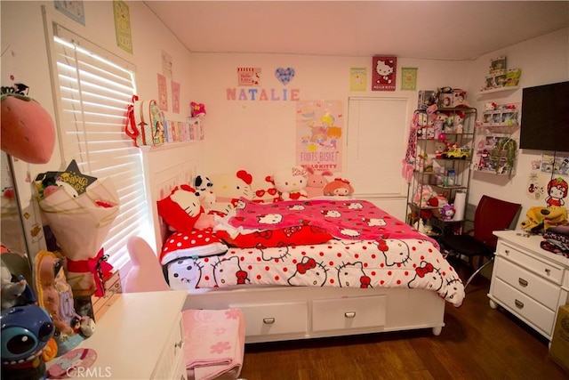 bedroom with dark wood-type flooring