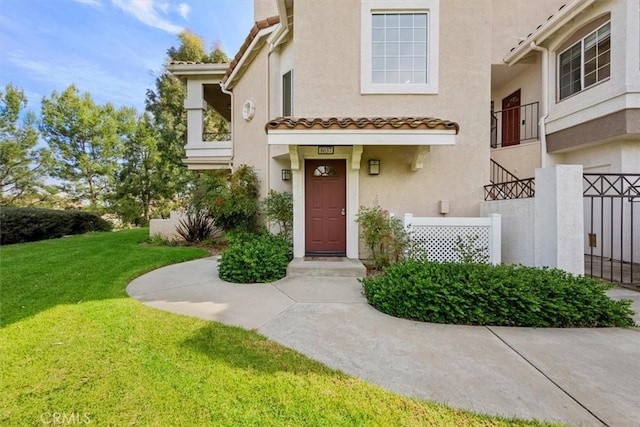 property entrance with a yard