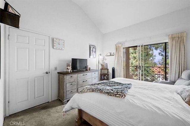 carpeted bedroom featuring access to exterior and lofted ceiling