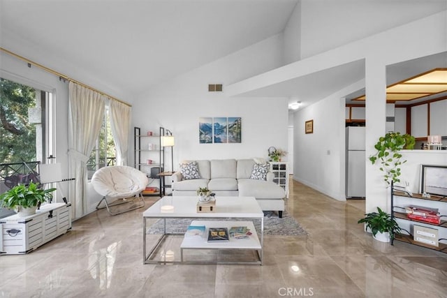 living room featuring vaulted ceiling