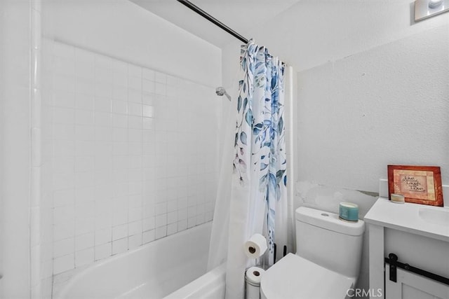 full bathroom featuring toilet, vanity, and shower / tub combo with curtain