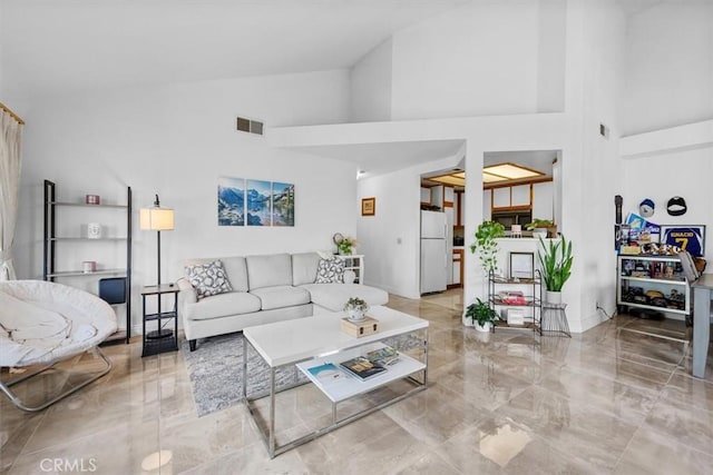 living room with a towering ceiling