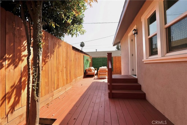 wooden deck featuring fence