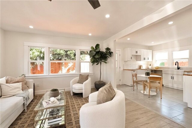 living area with recessed lighting and baseboards