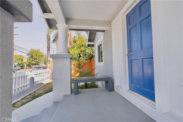 property entrance with covered porch