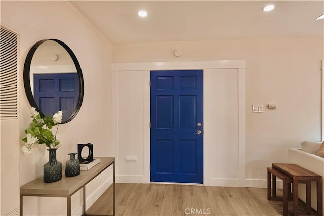 entrance foyer with light wood-style flooring, recessed lighting, and baseboards