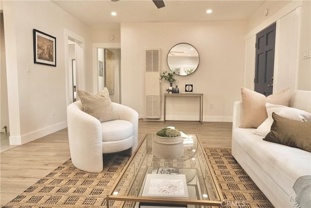 living room featuring visible vents, recessed lighting, wood finished floors, and baseboards