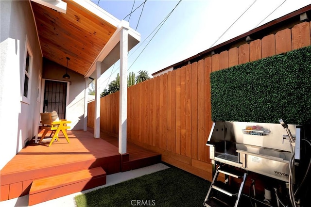 exterior space with covered porch and fence