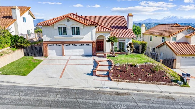 17931 Calle, Los Arboles, Rowland Heights, CA 91748 - mediterranean / spanish-style home featuring driveway, fence, an attached garage, and a tile roof