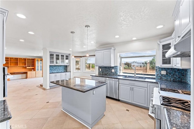 17931 Calle, Los Arboles, Rowland Heights, CA 91748 - kitchen featuring pendant lighting, dark stone counters, a kitchen island, a sink, and stainless steel appliances