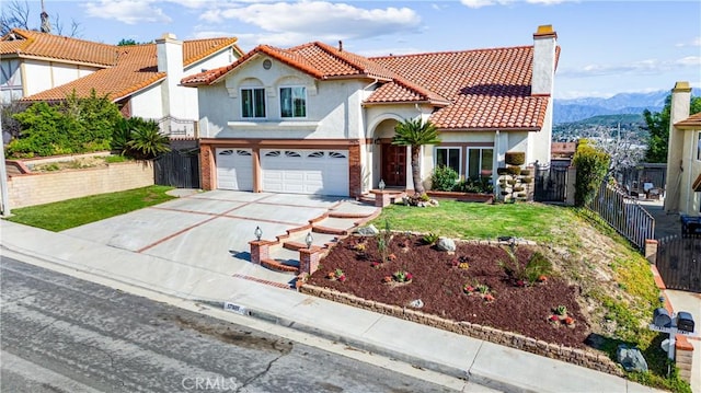 17931 Calle, Los Arboles, Rowland Heights, CA 91748 - mediterranean / spanish-style house with stucco siding, driveway, an attached garage, a tile roof, and fence