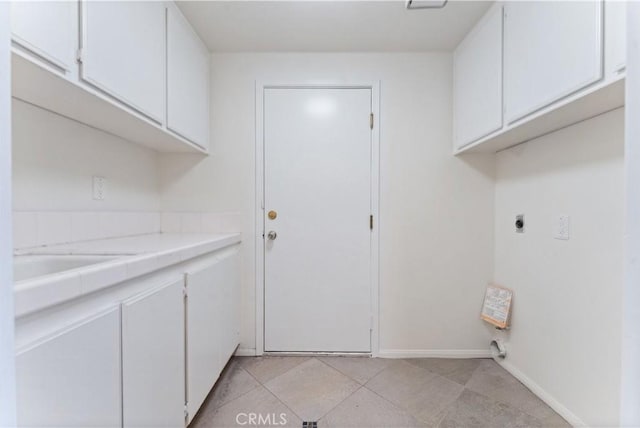 17931 Calle, Los Arboles, Rowland Heights, CA 91748 - washroom featuring light tile patterned flooring, a sink, hookup for an electric dryer, baseboards, and cabinet space