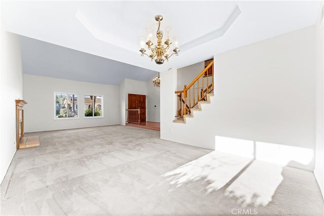 17931 Calle, Los Arboles, Rowland Heights, CA 91748 - unfurnished living room featuring a chandelier, a tray ceiling, carpet, and stairs