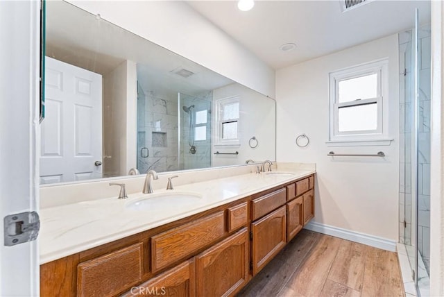 17931 Calle, Los Arboles, Rowland Heights, CA 91748 - bathroom featuring a sink, a shower stall, double vanity, and wood finished floors