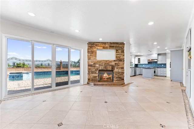 17931 Calle, Los Arboles, Rowland Heights, CA 91748 - unfurnished living room featuring recessed lighting, a stone fireplace, crown molding, and a textured ceiling