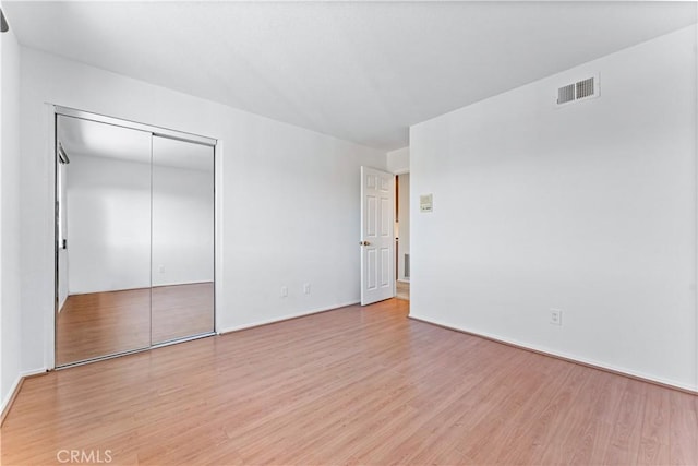 17931 Calle, Los Arboles, Rowland Heights, CA 91748 - unfurnished bedroom featuring visible vents, light wood-style flooring, a closet, and baseboards