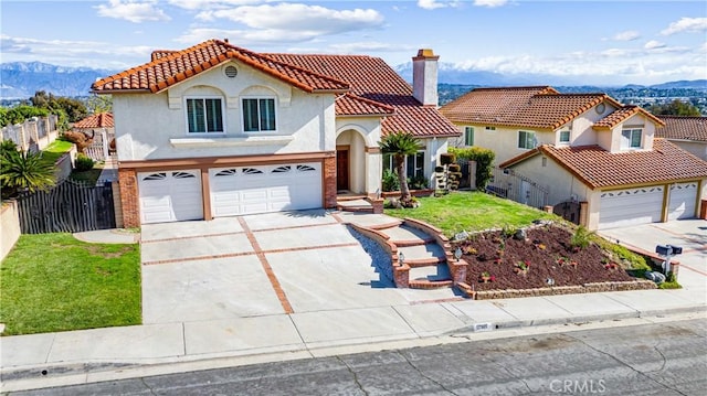 17931 Calle, Los Arboles, Rowland Heights, CA 91748 - mediterranean / spanish house with a tiled roof, fence, a garage, and driveway