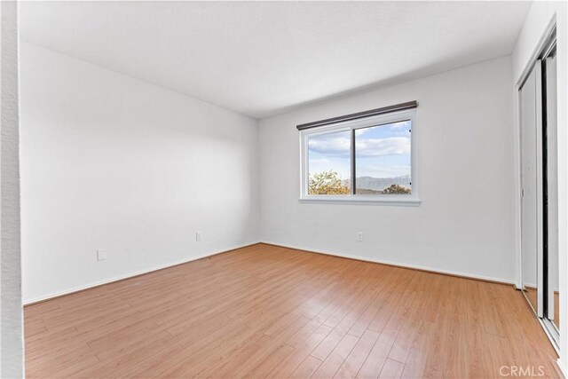 17931 Calle, Los Arboles, Rowland Heights, CA 91748 - unfurnished bedroom with a closet, light wood-style flooring, and baseboards