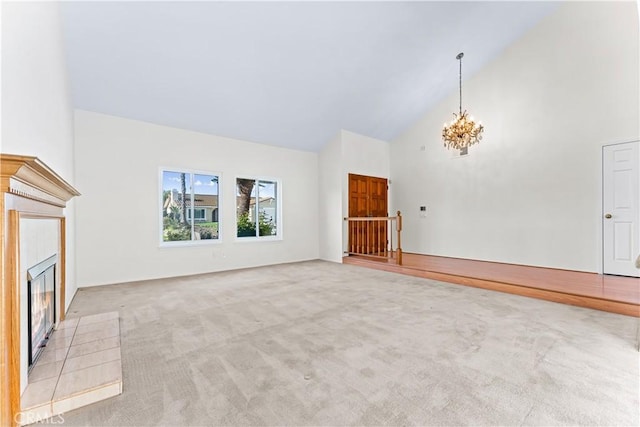 17931 Calle, Los Arboles, Rowland Heights, CA 91748 - unfurnished living room with light carpet, a fireplace, high vaulted ceiling, and a notable chandelier