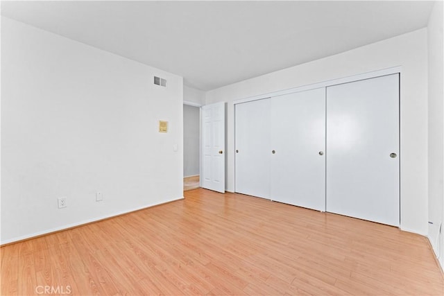 17931 Calle, Los Arboles, Rowland Heights, CA 91748 - unfurnished bedroom featuring light wood-type flooring, a closet, and visible vents
