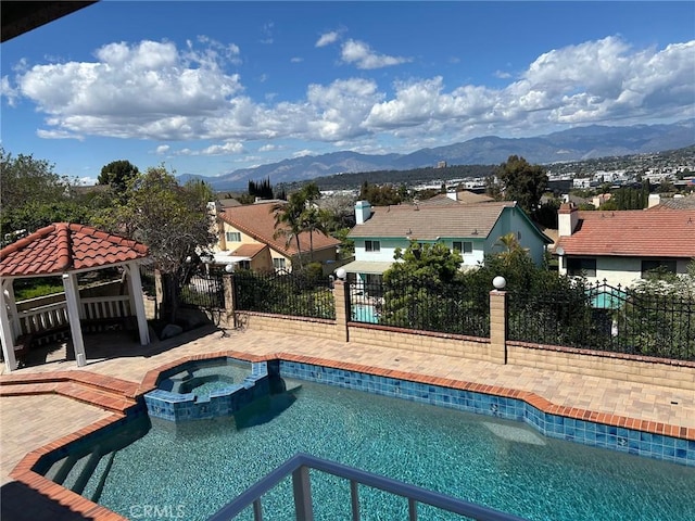 17931 Calle, Los Arboles, Rowland Heights, CA 91748 - view of swimming pool with a pool with connected hot tub, a mountain view, a gazebo, and fence