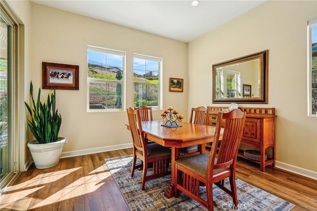 dining area with wood-type flooring