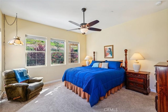 bedroom featuring ceiling fan and light colored carpet