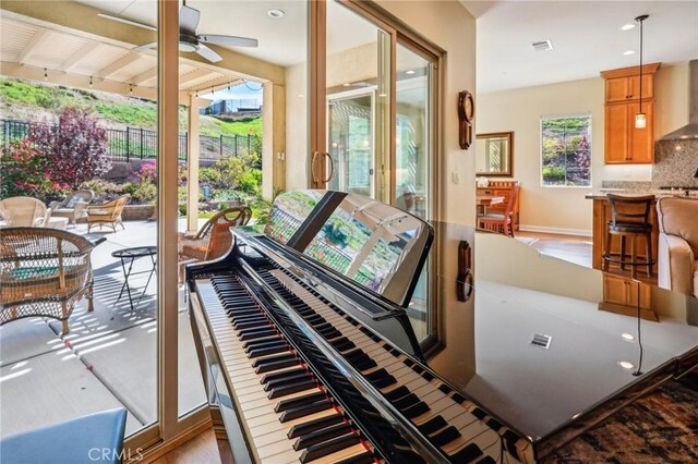 miscellaneous room featuring light hardwood / wood-style floors and ceiling fan