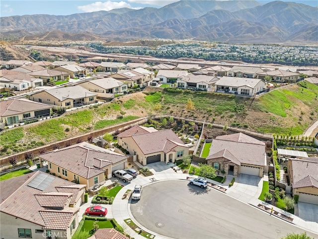 birds eye view of property with a mountain view