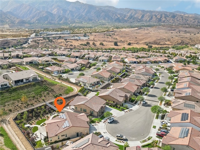 birds eye view of property with a mountain view