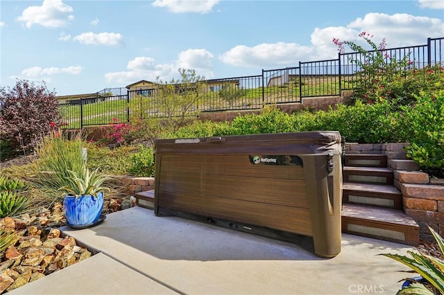 view of patio / terrace featuring a hot tub