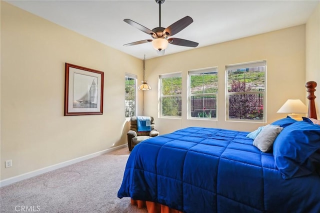 bedroom with ceiling fan and carpet