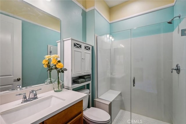 bathroom with toilet, walk in shower, and vanity