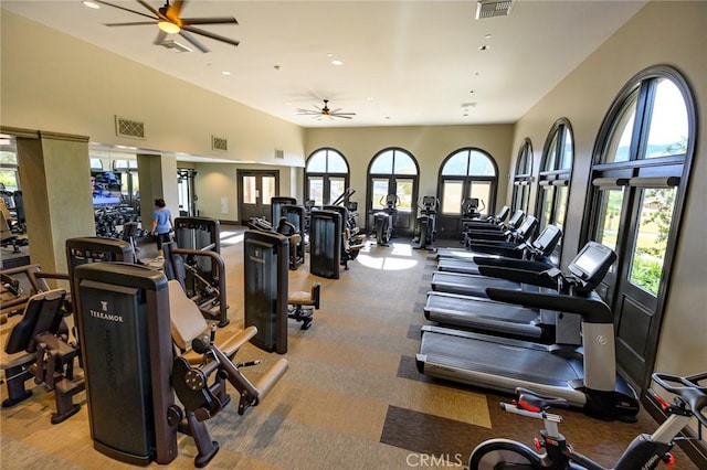 exercise room with ceiling fan